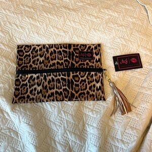 Brand new makeup junkie bag.  Leopard